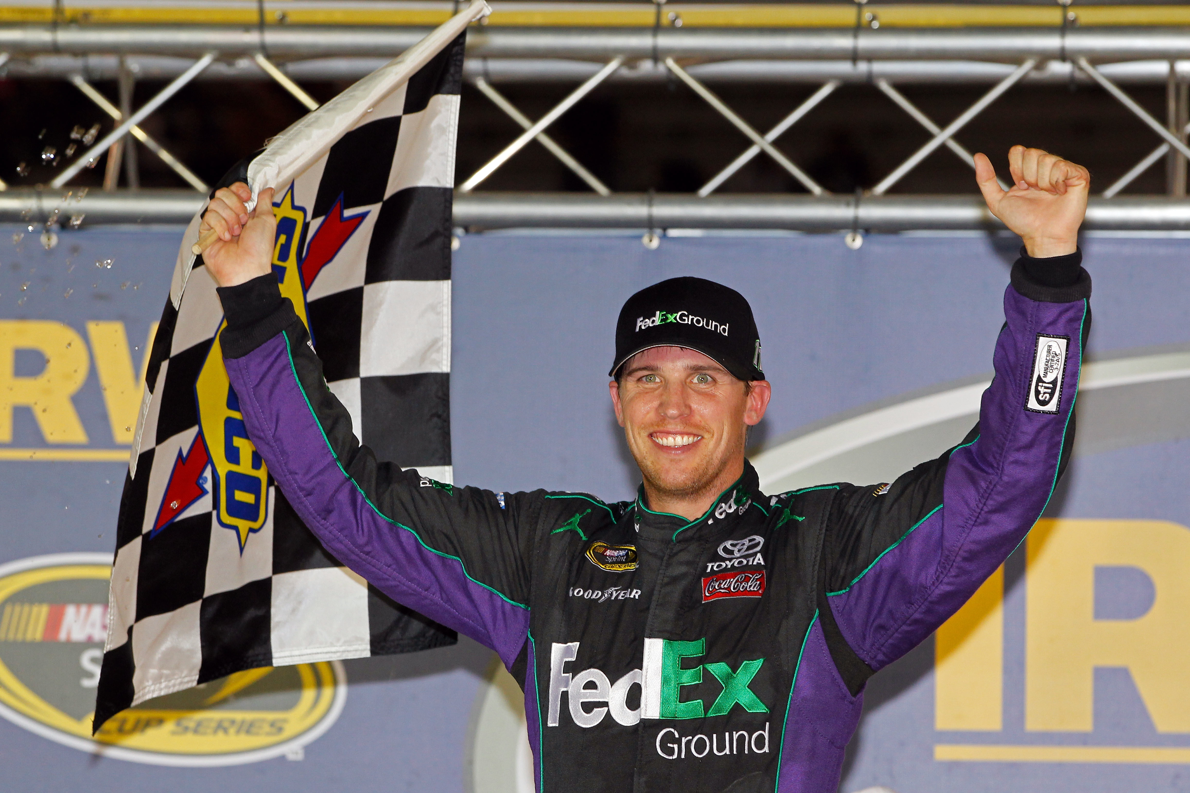 2012 Bristol2 Denny Hamlin Celebrates With Checkered Flag